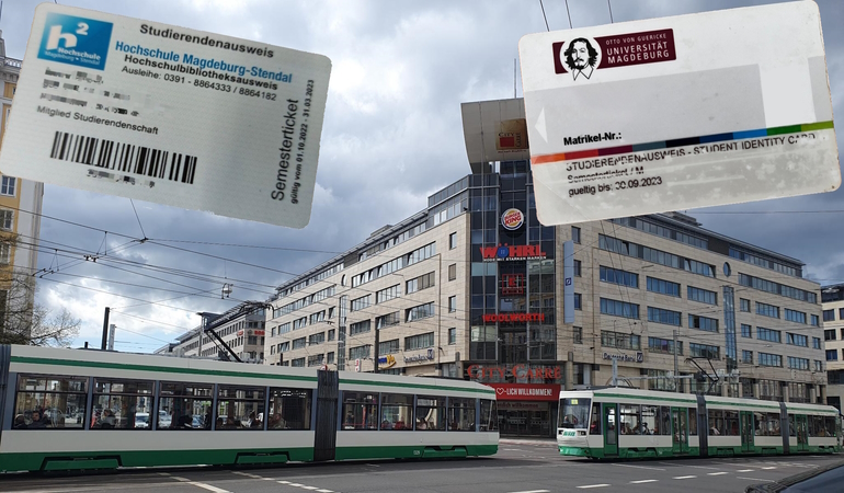 Tram auf der Kreuzung OvG-Reuterallee mit Semesterticket im Hintergrund