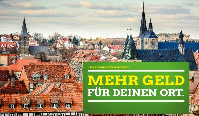 Stadtbild mit Forderung mit mehr Geld für die Kommunen Stadtbild mit Forderung mit mehr Geld für die Kommunen