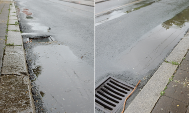 Wasser steht vor dem Gully an der Haltestelle Salbker Platz.