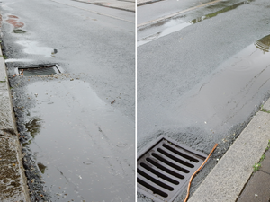 Wasser steht vor dem Gully an der Haltestelle Salbker Platz.