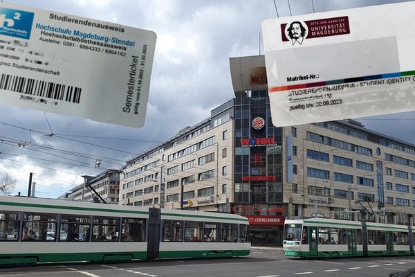 Tram auf der Kreuzung OvG-Reuterallee mit Semesterticket im Hintergrund