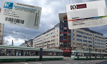 Tram auf der Kreuzung OvG-Reuterallee mit Semesterticket im Hintergrund 